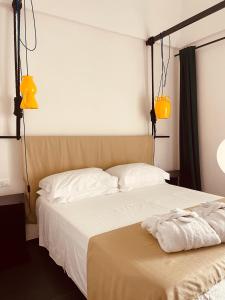 Voodi või voodid majutusasutuse Palazzo Biancofiore, suites & rooftop toas