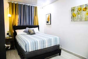 Postel nebo postele na pokoji v ubytování Apartamento hermoso Cercano al Aeropuerto