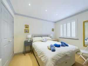 a bedroom with a bed with blue towels on it at Rokeby in Bamburgh