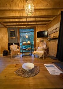 Posezení v ubytování Le chalet de l’Onde