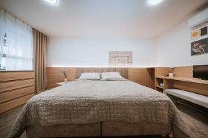 Posteľ alebo postele v izbe v ubytovaní Apartmány Reduta - new