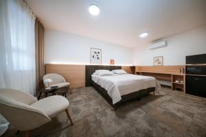 Posteľ alebo postele v izbe v ubytovaní Apartmány Reduta - new