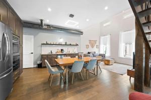 a kitchen and dining room with a table and chairs at Naturally Opulent - for Luxury-Seeking Travelers in Covington