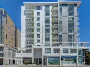 an apartment building with balconies on the side of it at The Bohemian, min 30-Day Stay with Breathtaking Views and Home Office by Victoria Prime! in Victoria