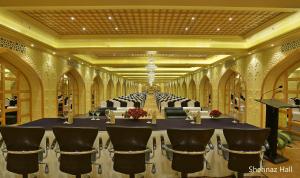 a large room with a long table and chairs at Hotel Clarks Shiraz in Agra +37 photos