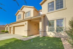 a house with a driveway and a garage at Pool and Patio San Tan Valley Getaway! in Queen Creek