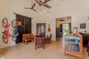 a living room with a bike hanging on the wall at Mamachá - Natural Residence in Valladolid