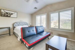 a bedroom with a bed and a couch and a table at Pool and Patio San Tan Valley Getaway! in Queen Creek +21 photos