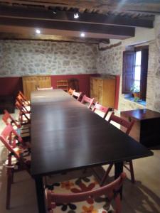 a large wooden table and chairs in a room at La Posada de Pesquera in Pesquera de Duero +71 photos