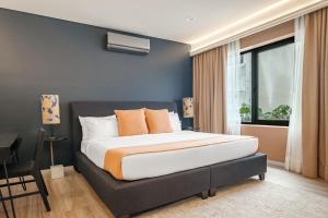 a bedroom with a large bed and a window at District Polanco by Lumina in Mexico City