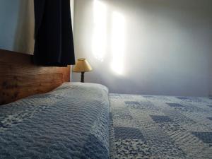 Postel nebo postele na pokoji v ubytování La Posada
