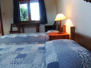 Postel nebo postele na pokoji v ubytování La Posada