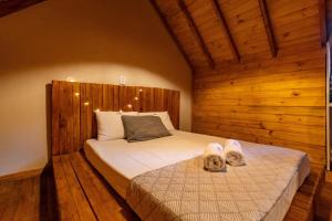 Ένα ή περισσότερα κρεβάτια σε δωμάτιο στο Rosa Green House Canela