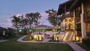 Um jardim em Apart Hotel Beira do Mar