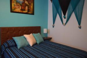 Cama o camas de una habitación en The Park 203 Vallarta Zona Romántica