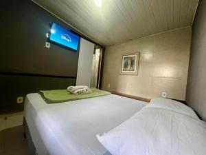 Espaço Verano - Suítes客房内的一张或多张床位
