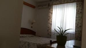 Postel nebo postele na pokoji v ubytování Hotel Le Viole
