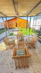 a patio with a table and chairs and a building at كوخ سترين in Tabuk