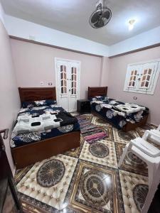Postel nebo postele na pokoji v ubytování Siwa Shali Hostel