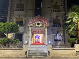 a building with a door in the front of it at فندق اربد بلازا in Irbid