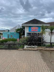 a building with a sign in front of it at 48 Rosewood Isle of Wight in Porchfield