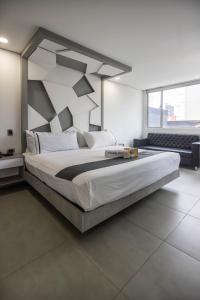 Postel nebo postele na pokoji v ubytování Mandala Hotel Centro + 37 fotografií