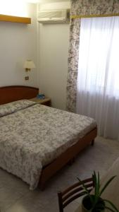 Postel nebo postele na pokoji v ubytování Hotel Le Viole