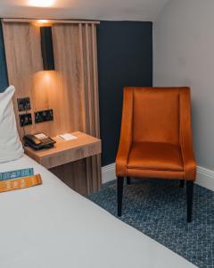 Postel nebo postele na pokoji v ubytování Springfield Hotel