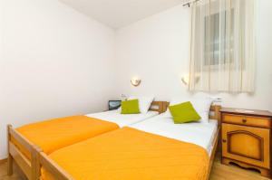 Postel nebo postele na pokoji v ubytování Apartments Mira