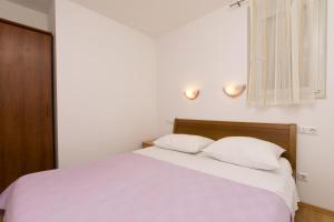 Postel nebo postele na pokoji v ubytování Apartments Mira