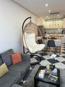 a living room with a couch and a table at Apartment in Biscoitos Terceira in Biscoitos