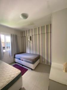 Ένα ή περισσότερα κρεβάτια σε δωμάτιο στο Porto Real Resort Suítes, Paraíso em Angra