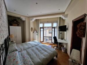 Postel nebo postele na pokoji v ubytování Uría 25 rooms