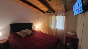 Una cama o camas en una habitación de Lomas del Uritorco - Casa de Alq x Temp