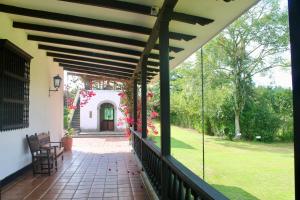 a view of the porch of a house at Hotel Hacienda Supracafe in Popayan