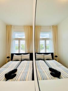 Ein Bett oder Betten in einem Zimmer der Unterkunft 5BR Shared Apt Ideal for Groups 7 Min to Westbahnhof