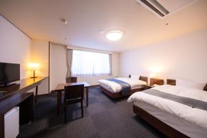 Postel nebo postele na pokoji v ubytování Yufuin Hotel Shuhokan
