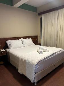 Kama o mga kama sa kuwarto sa MOAN Hotel