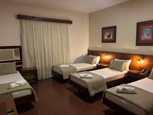 Kama o mga kama sa kuwarto sa MOAN Hotel