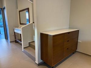 a room with a dresser and a mirror in a room at Residencia, Cluster 3 Habitaciones con baño in Monterrey +6 photos