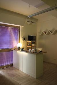 a kitchen with a counter and a large window at Il Soffio Di Eolo in Popoli