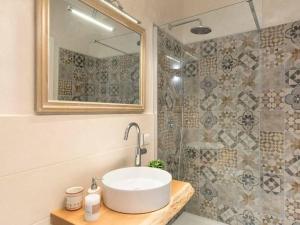 a bathroom with a sink and a shower at Apartment in Baveno with Lake Maggiore Views in Baveno +32 photos