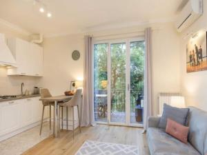 a kitchen and living room with a couch and a table at Apartment in Baveno with Lake Maggiore Views in Baveno