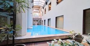 an indoor swimming pool in a building at Puente de la Mujer in Buenos Aires