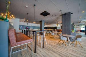 Restaurace v ubytování FourSide Hotel Salzburg Messe, Trademark Collection by Wyndham