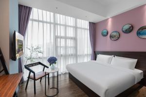 Postel nebo postele na pokoji v ubytování Spring Time Hotel