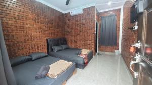 Posezení v ubytování RumaMataAyer Homestay Islam Semabok Perdana - Melaka