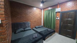 Posezení v ubytování RumaMataAyer Homestay Islam Semabok Perdana - Melaka