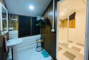 a bathroom with a shower and a sink at บ้านริมเลปากประ Banrimlay Pakpra in Phatthalung +61 photos