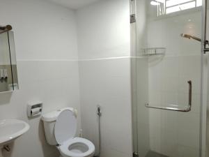 a bathroom with a toilet and a shower and a sink at MGM-Tebrau City Walk within 5 min to AEON Mall, Ikea & Toppen in Johor Bahru +50 photos